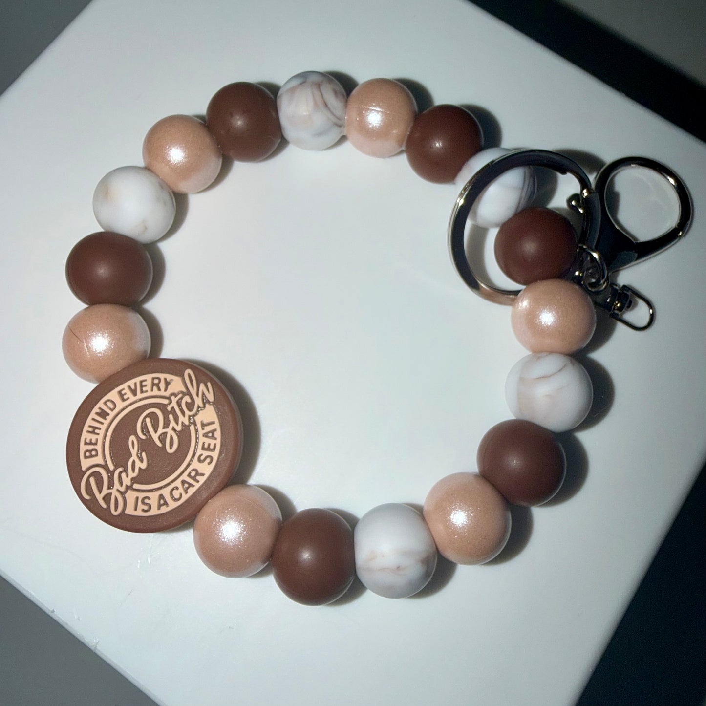 Brown 'Behind Every Car Seat is a Bad B*tch' Beaded Wristlet